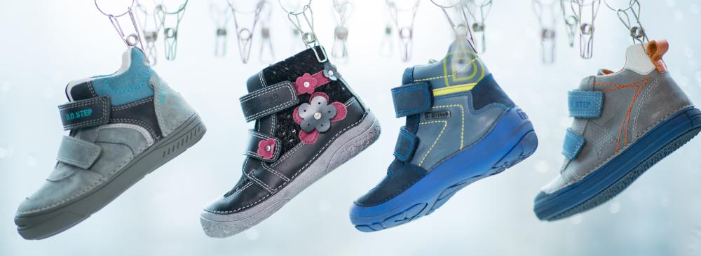 funny picture of four colorful boots hanging from clothpins
